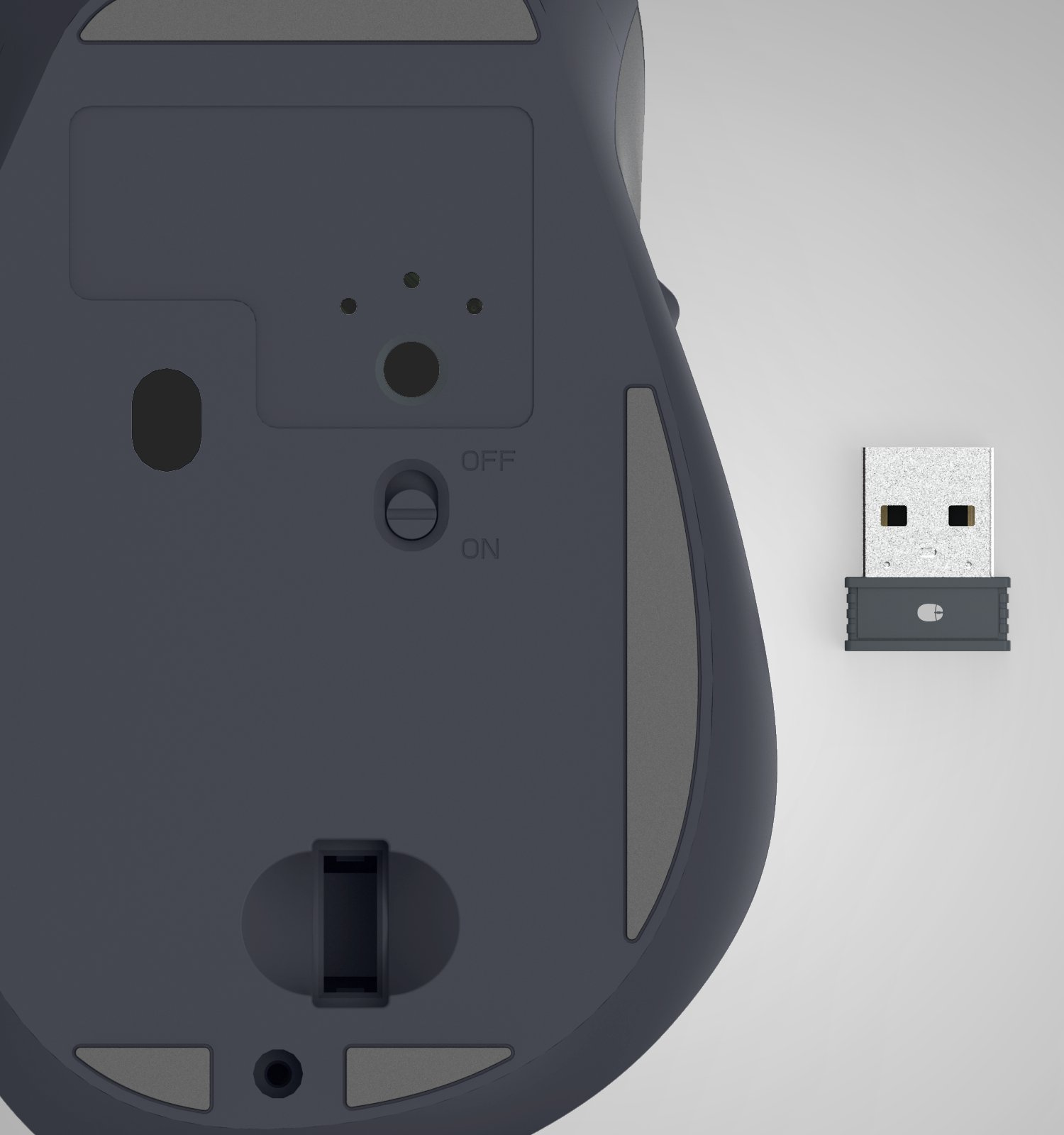 Vista inferior de un ratón de ordenador inalámbrico gris oscuro con un interruptor de encendido y un pequeño receptor USB.