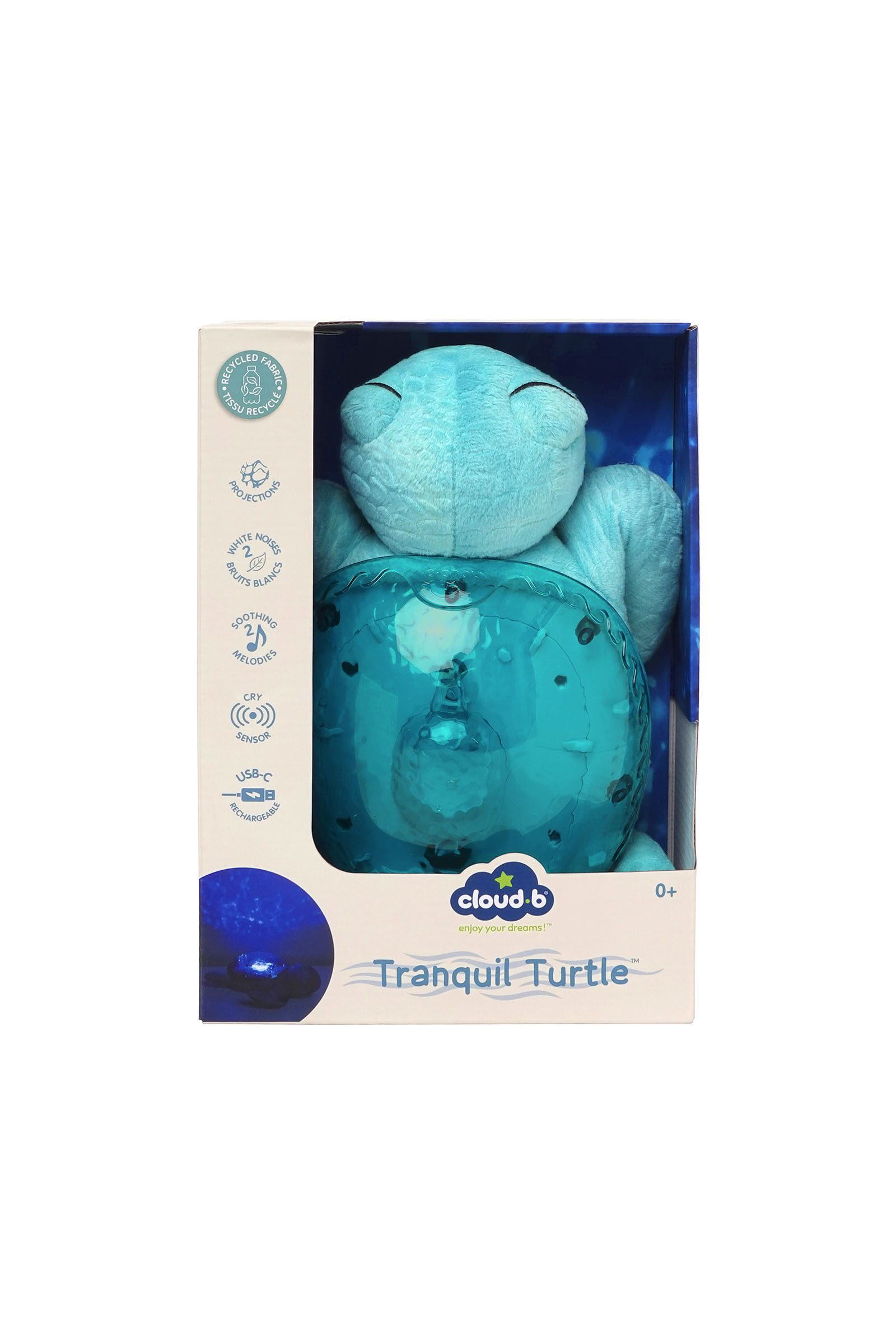 Tranquil Turtle yazılı ambalaj içinde sert kabuklu açık mavi peluş kaplumbağa.