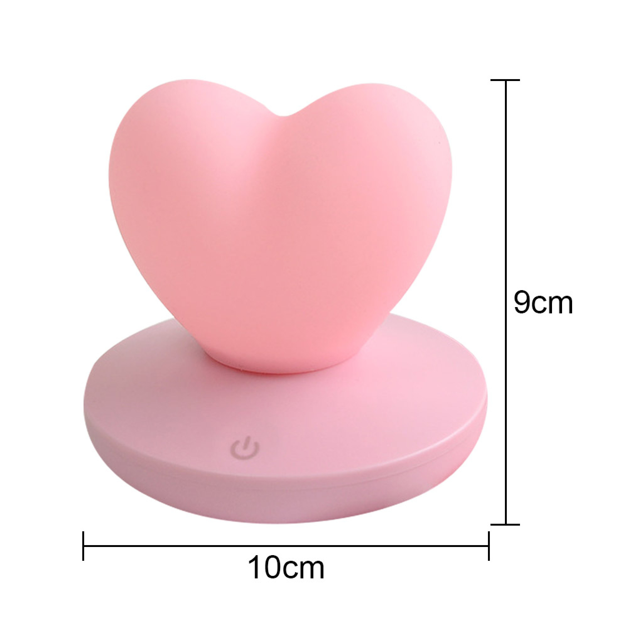 Rosa, herzförmige Lampe auf rundem Sockel, 10x9 cm groß, mit Power-Symbol.