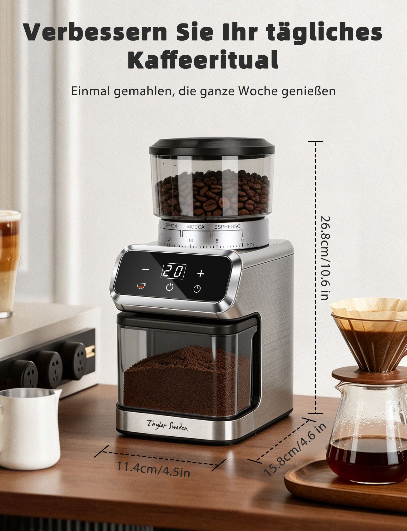 Eine Kaffeemühle mit Bohnenbehälter oben und gemahlenem Kaffee unten auf einem Holztisch mit Maßangaben.