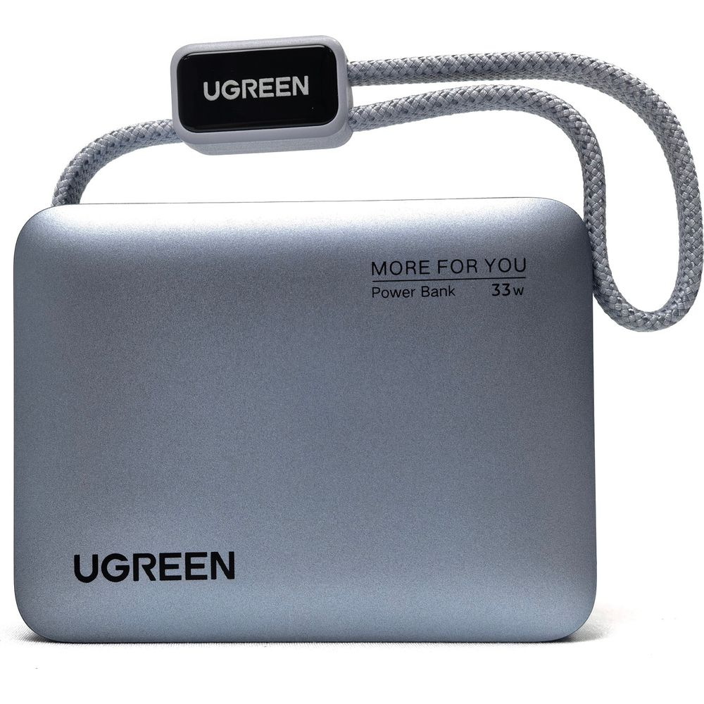Srebrny power bank UGREEN 33W z zaokrąglonymi rogami i szarym paskiem na rękę.