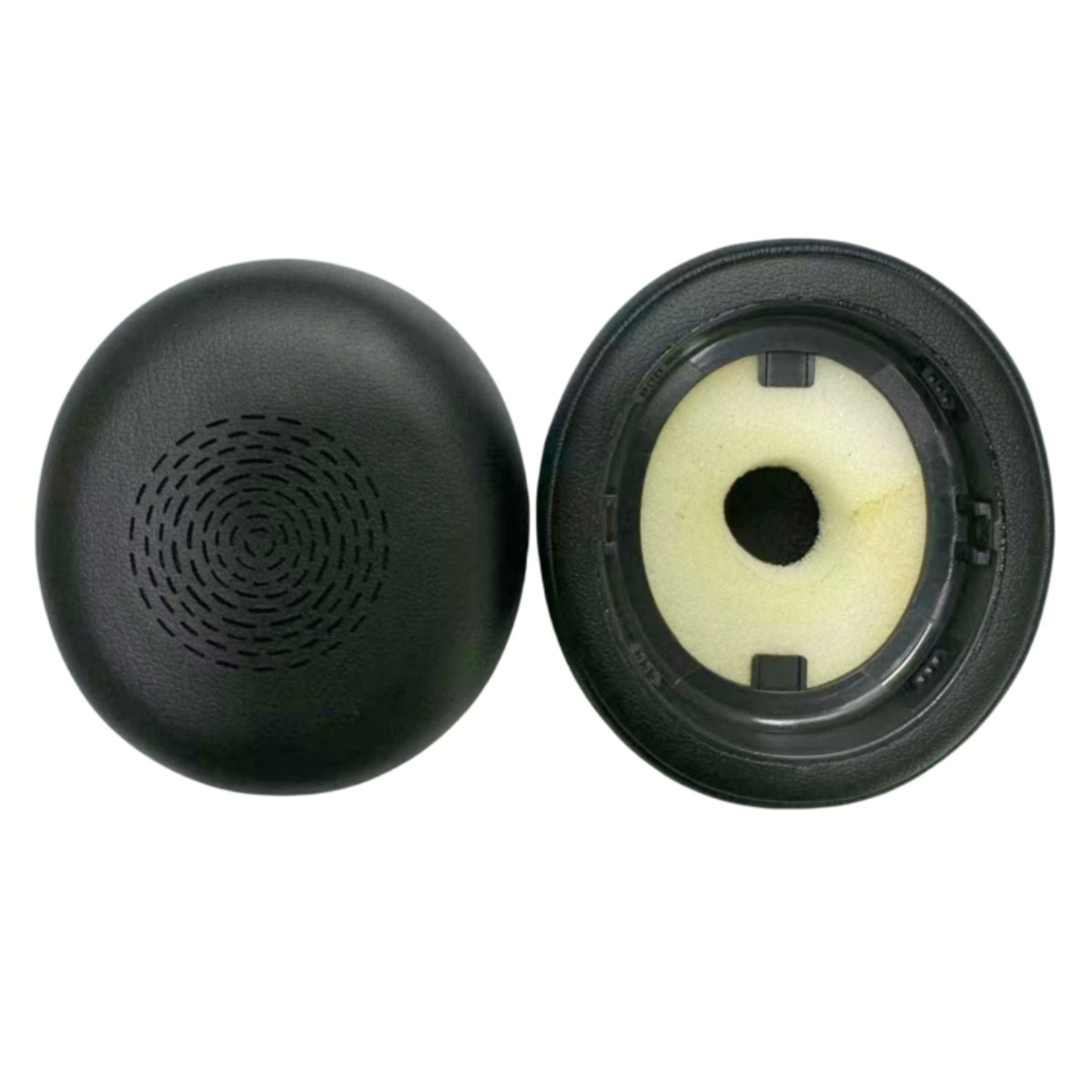 Two black circular headphone earpads shown from front and back on a white background.