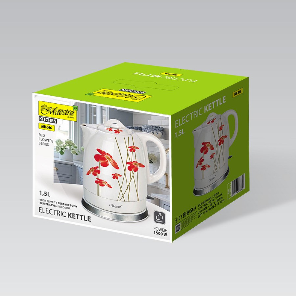 Zielone pudełko z białym ceramicznym czajnikiem elektrycznym w czerwone kwiaty.