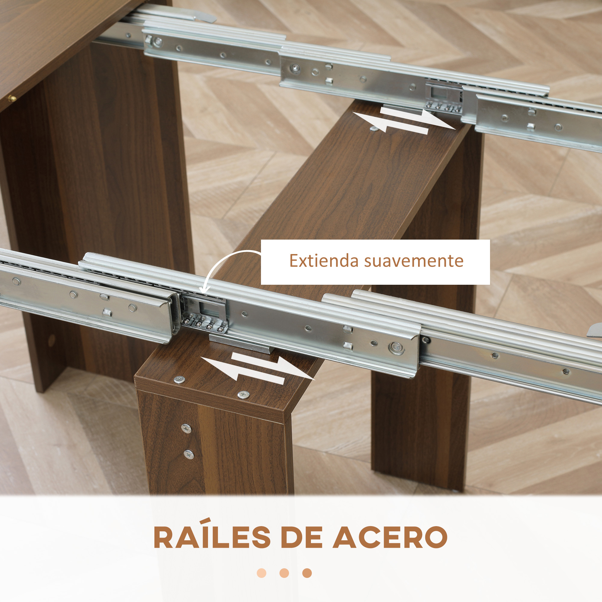 Mesa de madera extensible con rieles de acero lisos sobre suelo de espiga.