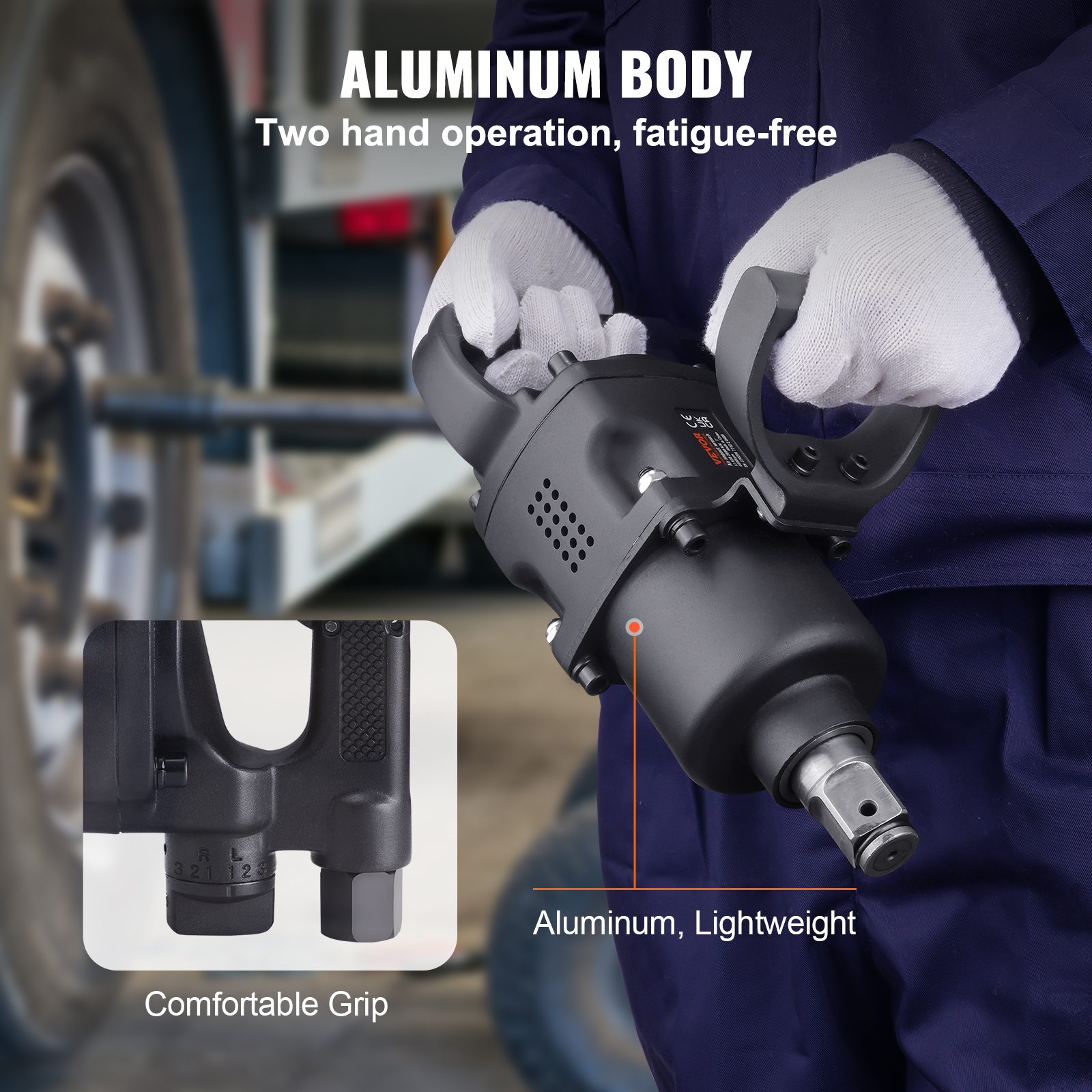 Un trabajador con uniforme azul y guantes blancos sostiene una llave de impacto de aluminio negra frente a un camión.