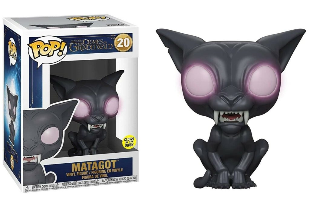 Una figura in vinile Pop! di Matagot da Animali Fantastici, gatto nero con occhi luminosi accanto alla scatola.
