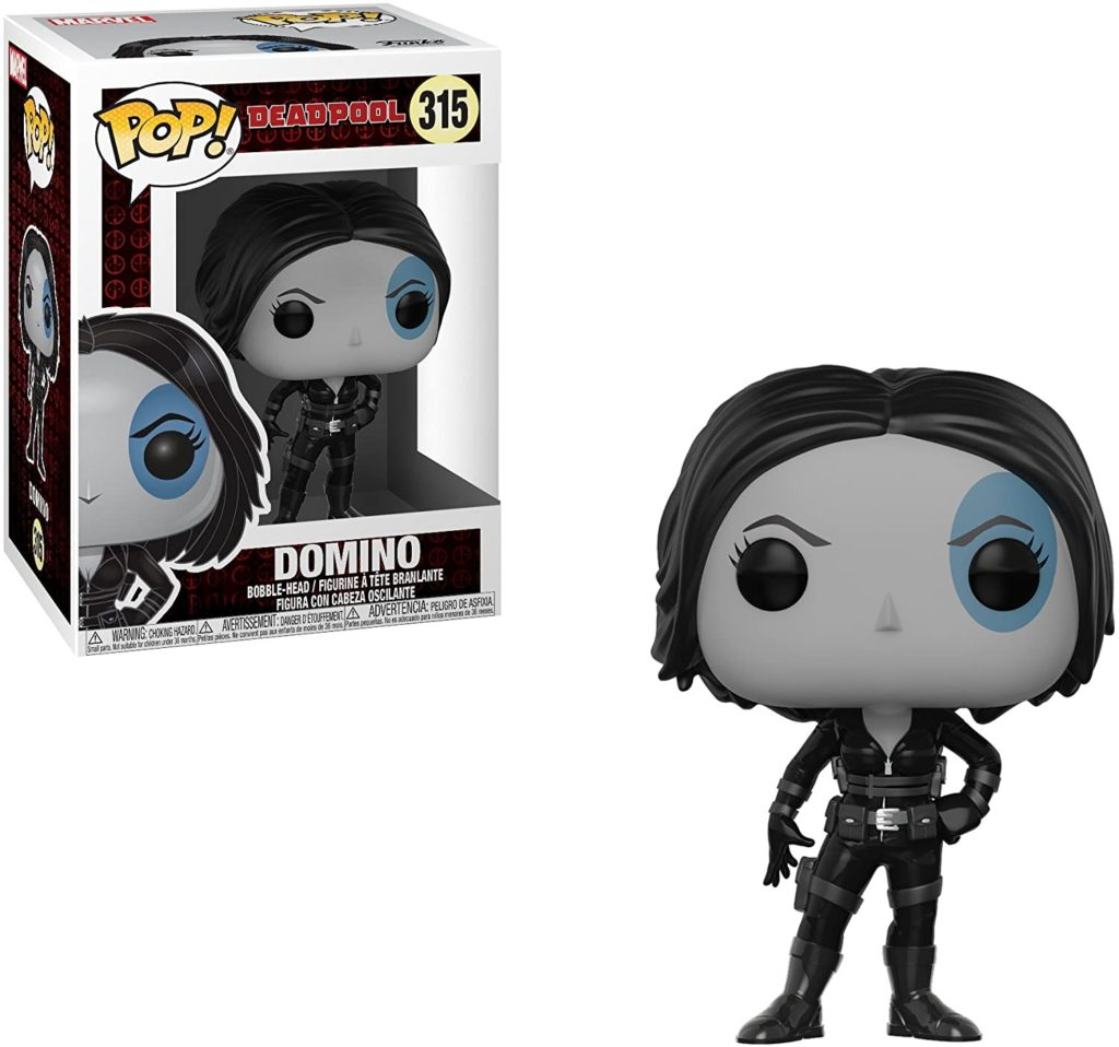 Funko Pop Domino Figur in schwarz-weiß mit einem blauen Fleck über dem linken Auge und ihrer Verpackung.