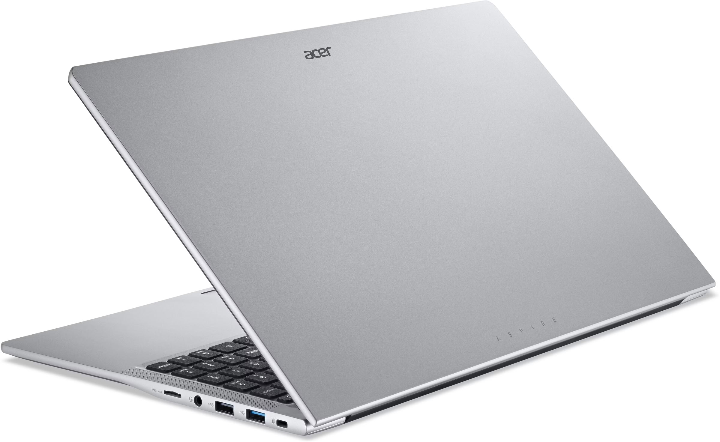 Un ordenador portátil plateado Acer Aspire sobre una superficie blanca, mostrando su tapa cerrada y los puertos.