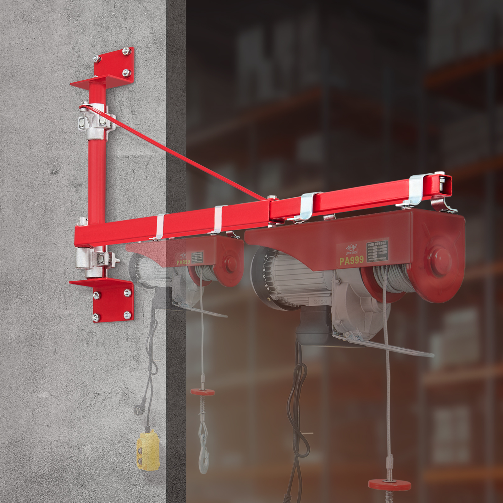 Polipasto eléctrico rojo montado en una pared de hormigón con brazo extensible.