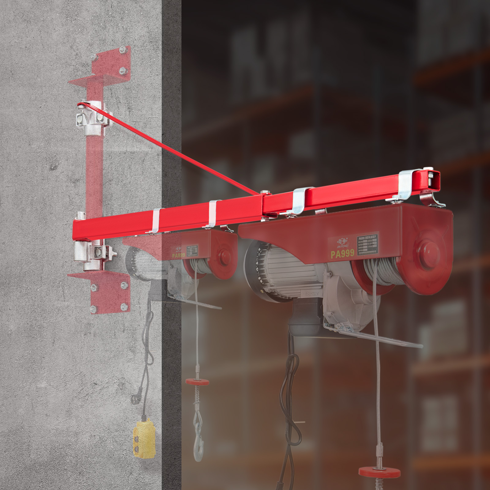 Un polipasto eléctrico rojo está montado en una pared de hormigón gris, con un fondo borroso.