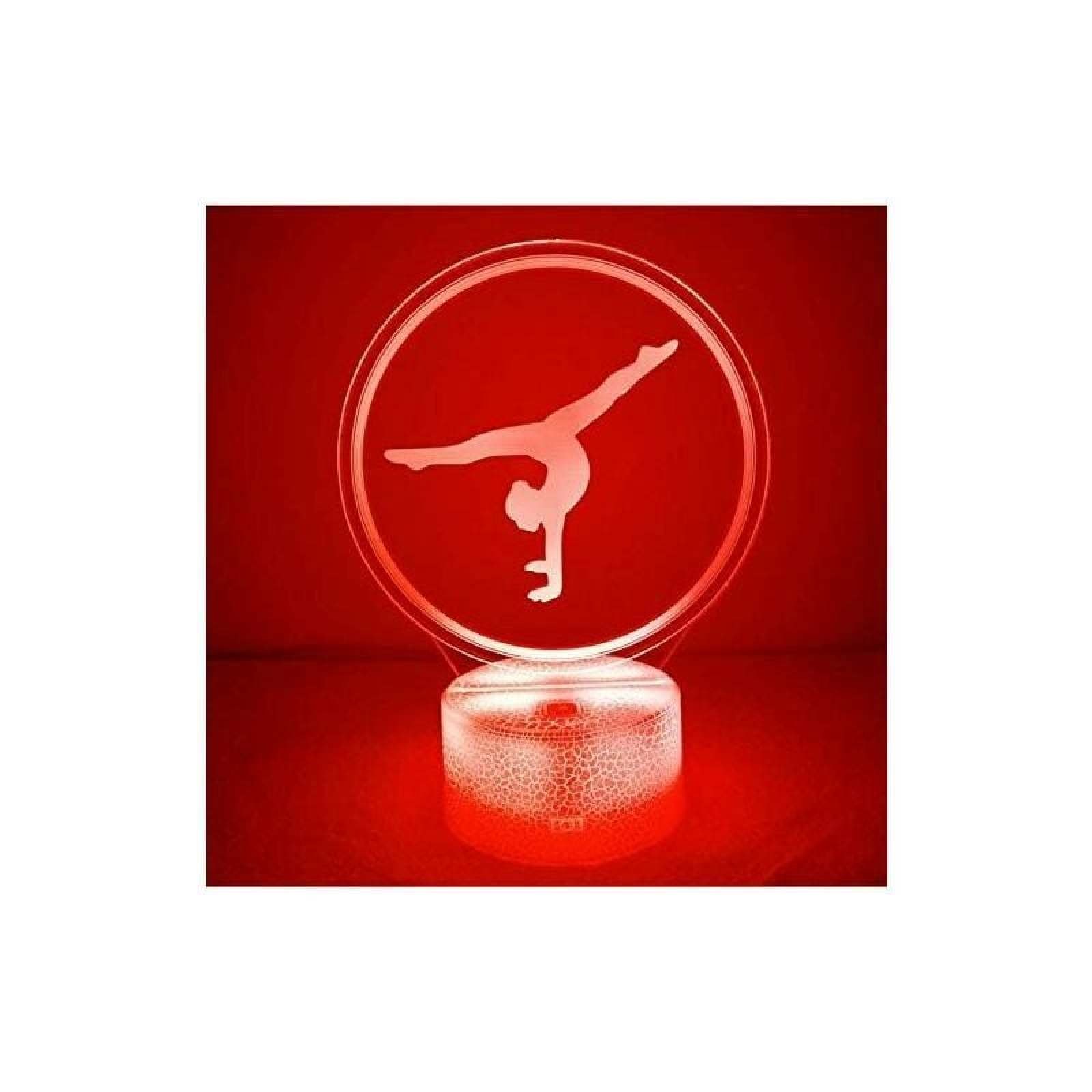 Eine rote LED-Lampe zeigt eine kreisrunde Acrylplatte mit einer gravierten Turnerin im Handstand.