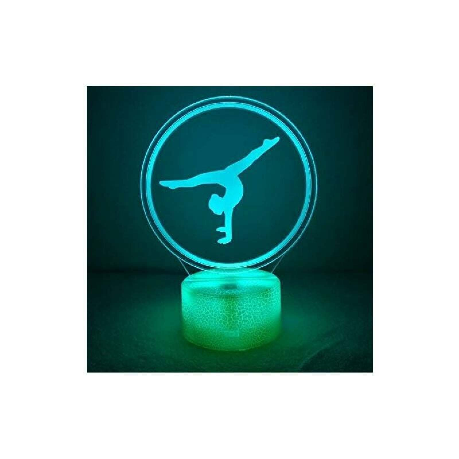 Eine grüne LED-Lampe mit einer Acrylscheibe zeigt die Silhouette einer Turnerin in einem Ring.