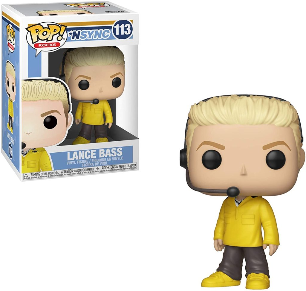 Funko Pop Vinyl Figur von Lance Bass in gelbem Pullover mit Headset, neben der Originalverpackung.
