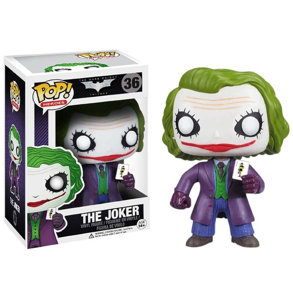 The Joker Pop! Vinyl-Figur mit grünem Haar, lila Mantel und Spielkarte in der Hand neben ihrer Verpackung.