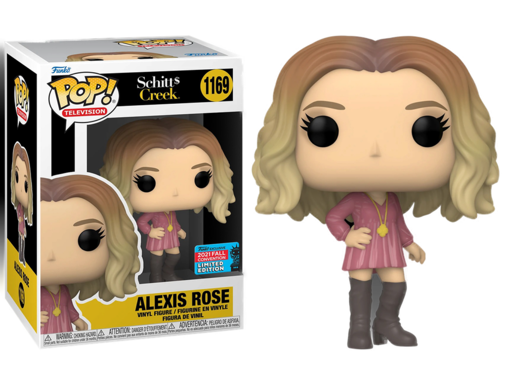 Alexis Rose Funko Pop Vinyl-Figur in rosafarbenem Kleid und grauen Stiefeln neben ihrer Schachtel.