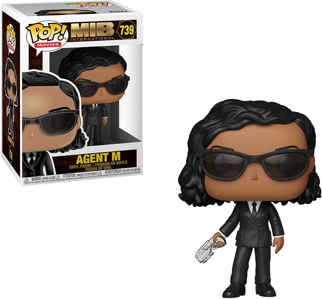 Agent M Funko Pop Vinyl-Figur im schwarzen Anzug und Sonnenbrille mit kleiner Waffe neben der Verpackung.