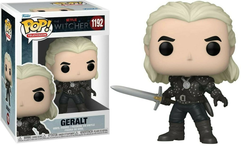 Figurine Funko Pop de Geralt avec cheveux blancs et épée à côté de sa boîte.
