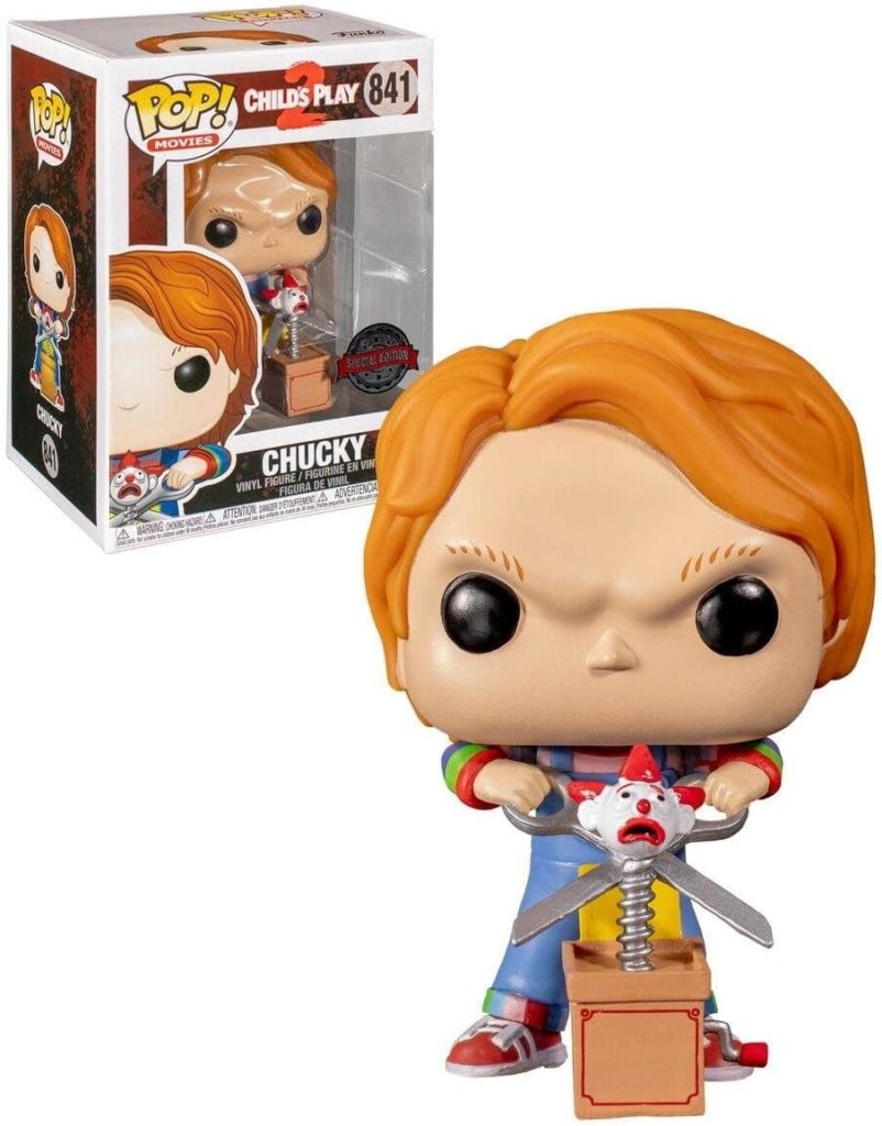 Figura de vinilo Funko Pop de Chucky con un juguete sorpresa, mostrada junto a su caja.