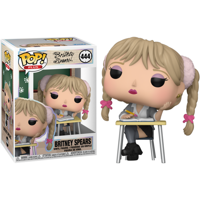 Figura Funko Pop de Britney Spears sentada en un pupitre junto a su caja en fondo negro.