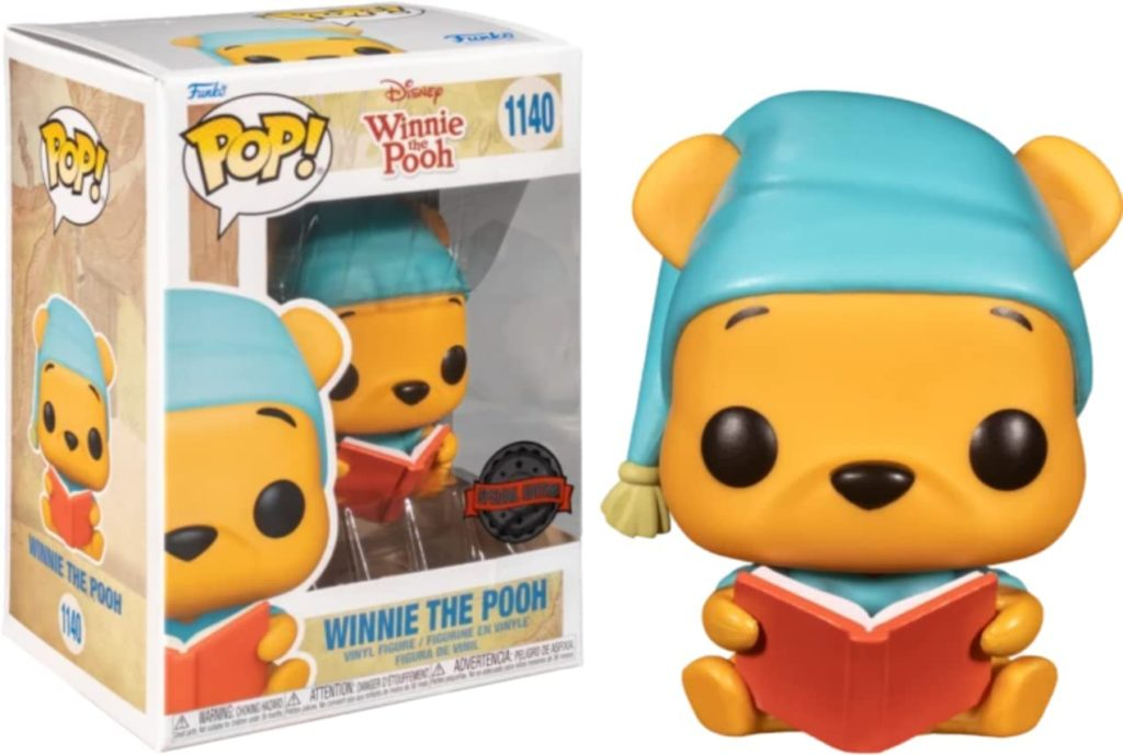 Figura de vinilo Funko Pop de Winnie the Pooh con gorro azul leyendo un libro rojo, junto a su caja.