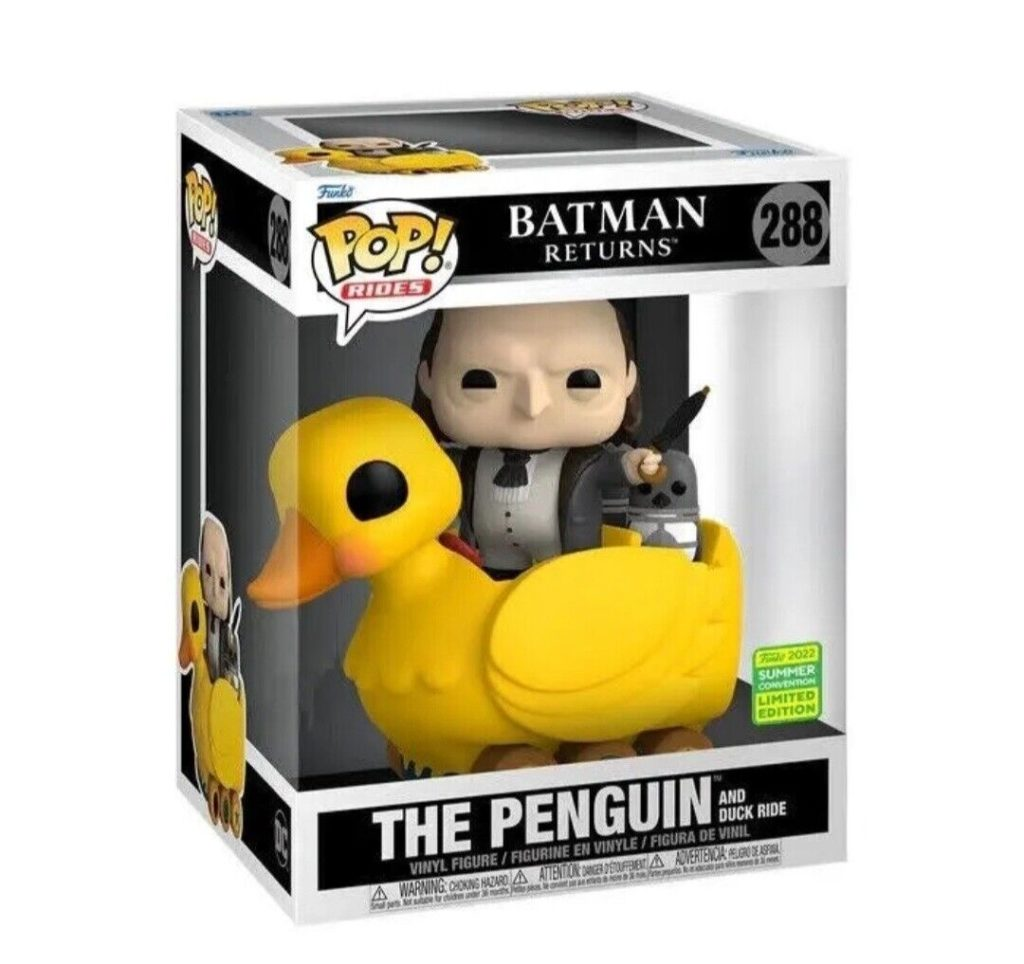 Funko Pop Figur von Pinguin auf einer gelben Ente aus Batman Returns in einer Sammlerbox.