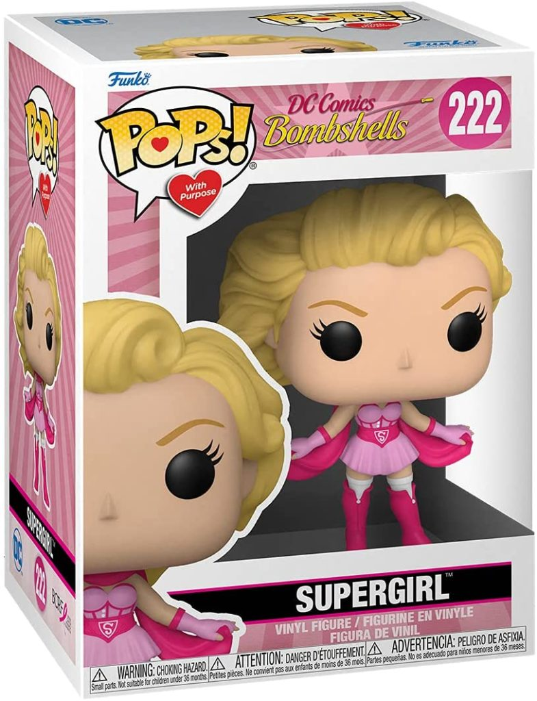 Figura Funko Pop di Supergirl in abito rosa e bianco dentro una scatola colorata.