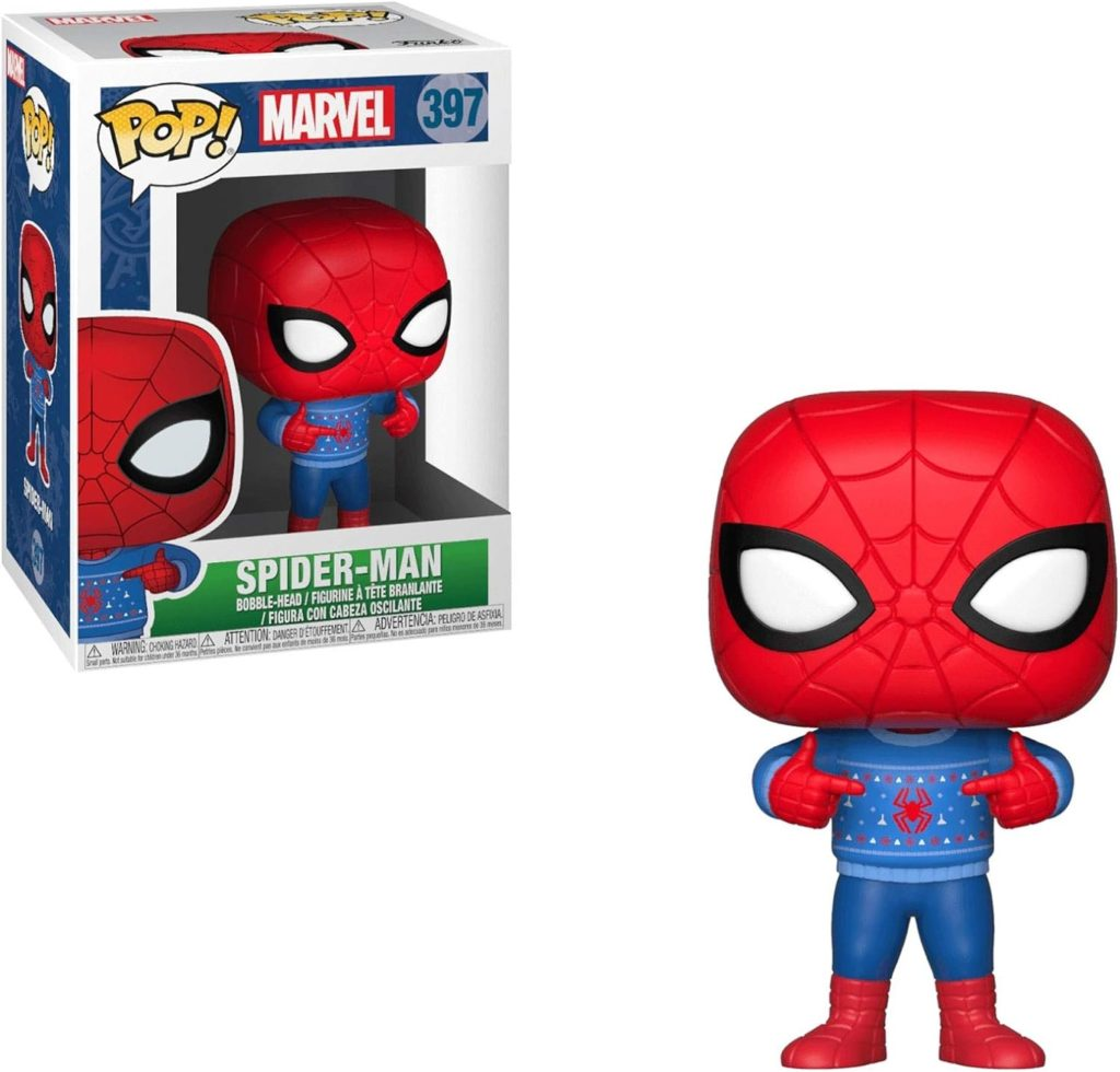 Action figure Funko Pop di Spider-Man con maglione natalizio blu, nella scatola e in piedi accanto.