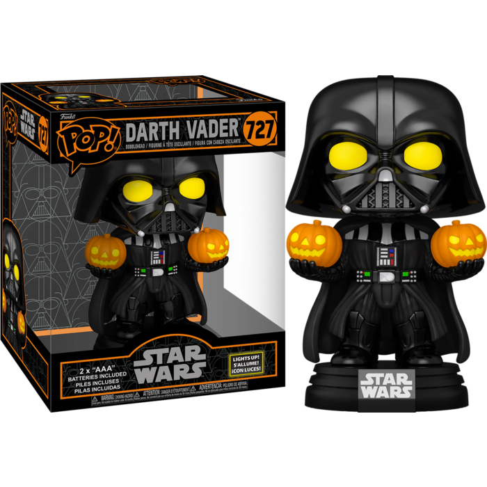 Figura Funko Pop de Darth Vader con ojos y calabazas brillantes, junto a su caja original.