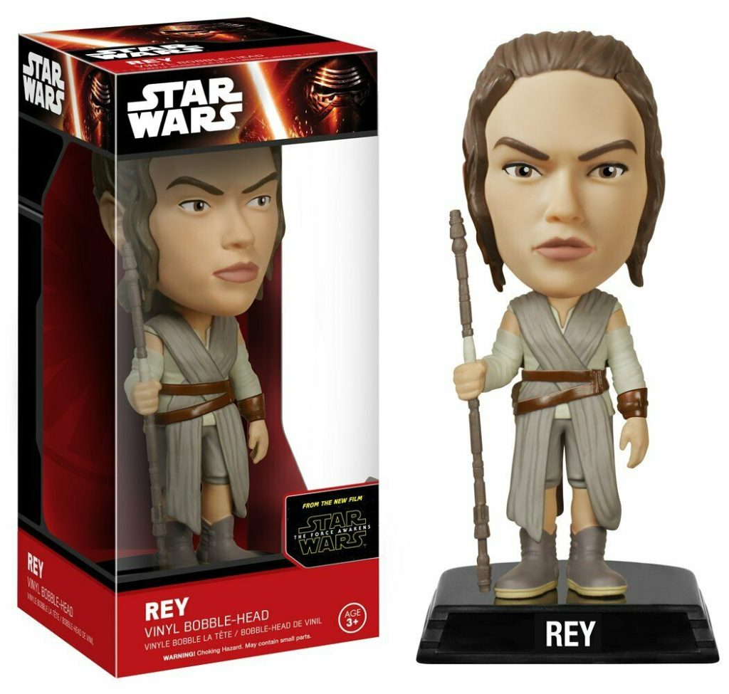 Rey Wackelkopf-Figur aus Vinyl mit Stab, außerhalb der Star Wars-Verpackung.