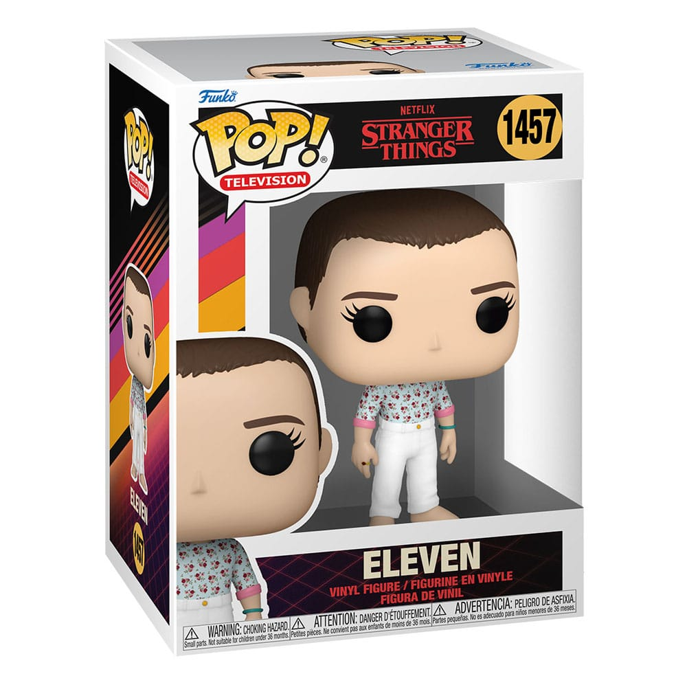 Funko Pop! Figur von Eleven aus Stranger Things in ihrer Box mit Blumenhemd und weißen Hosen.