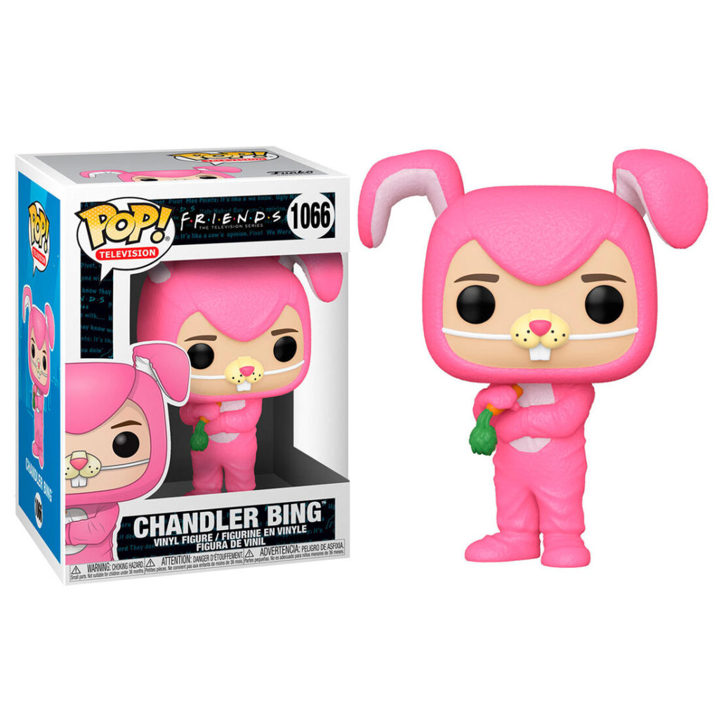 Figure Funko Pop di Chandler Bing in costume da coniglio rosa con carota vicino alla scatola.