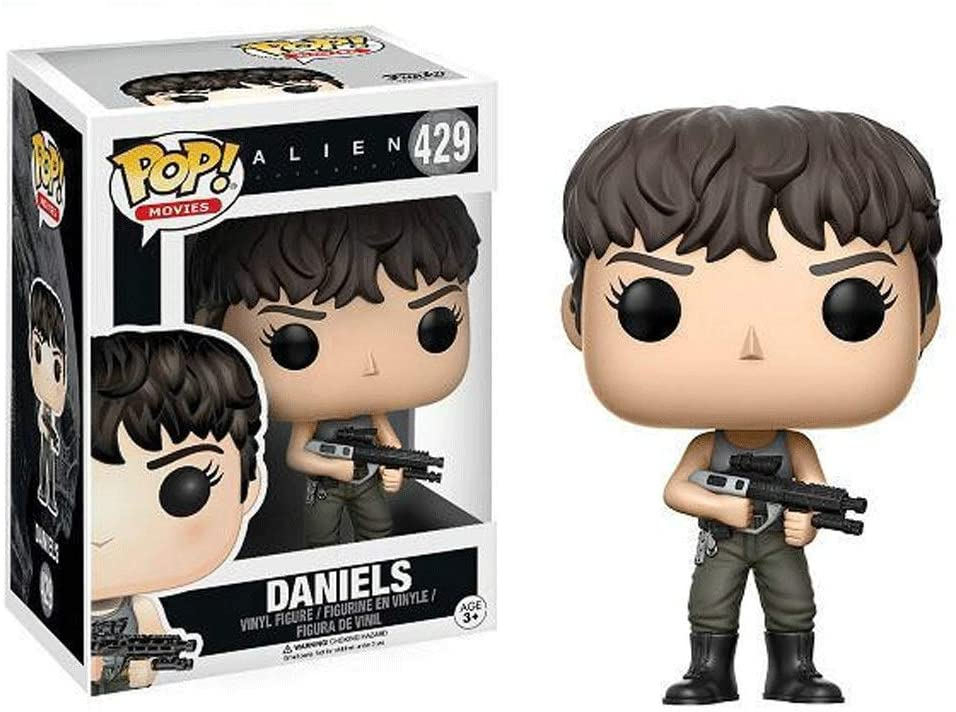 Funko Pop Daniels Vinyl-Figur aus Alien mit Gewehr, stehend neben ihrer Verpackung.