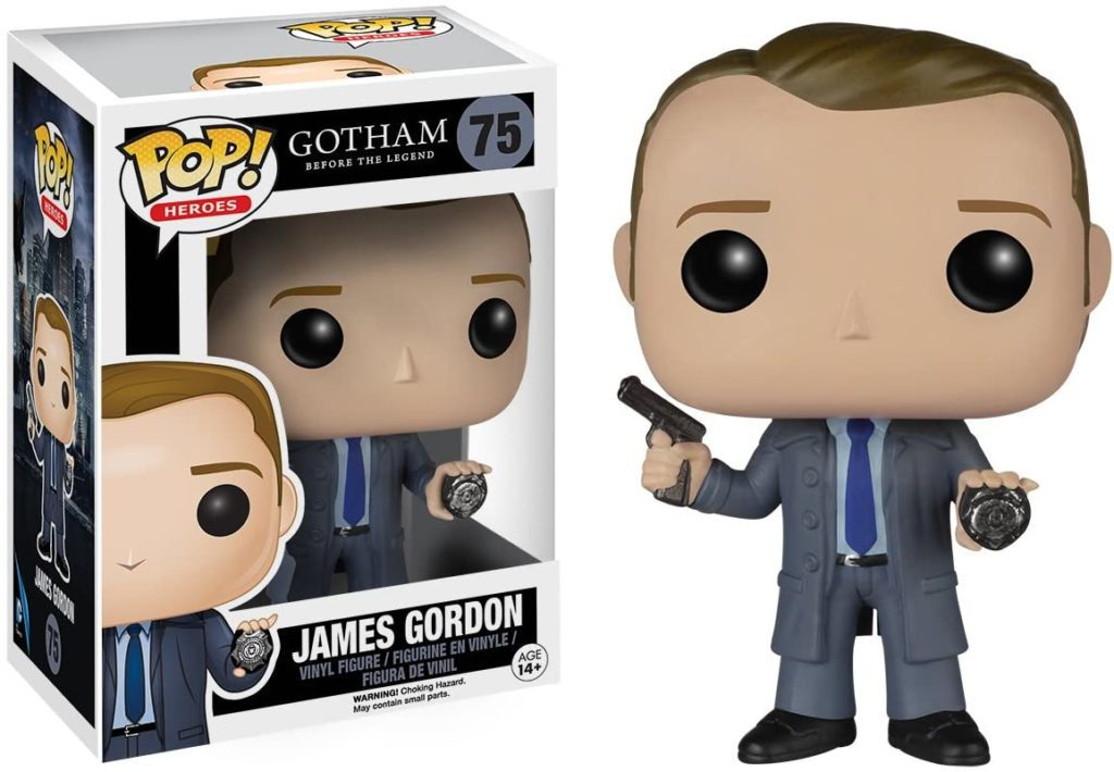 James Gordon Funko Pop Figur mit Waffe und Abzeichen, neben der passenden Schachtel.