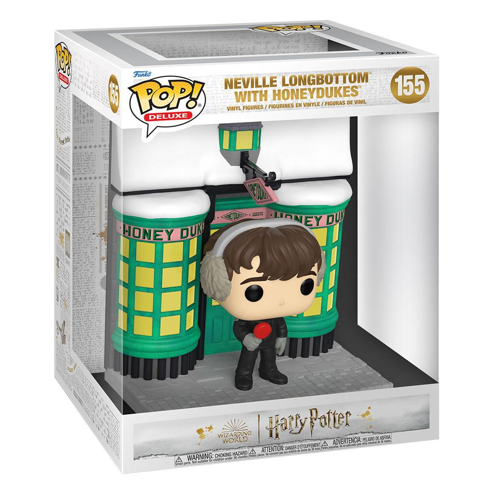 Neville Longbottom Pop Deluxe Figur vor einer verschneiten Honeydukes-Shopkulisse in der Verpackung.