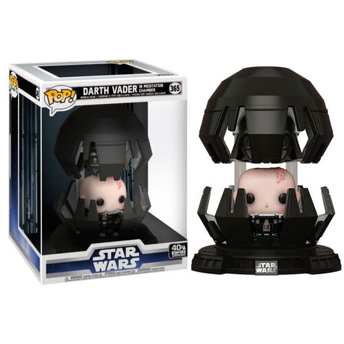 Eine Funko Pop Figur von Darth Vader in seiner Meditationskammer vor der Star Wars Verpackung.