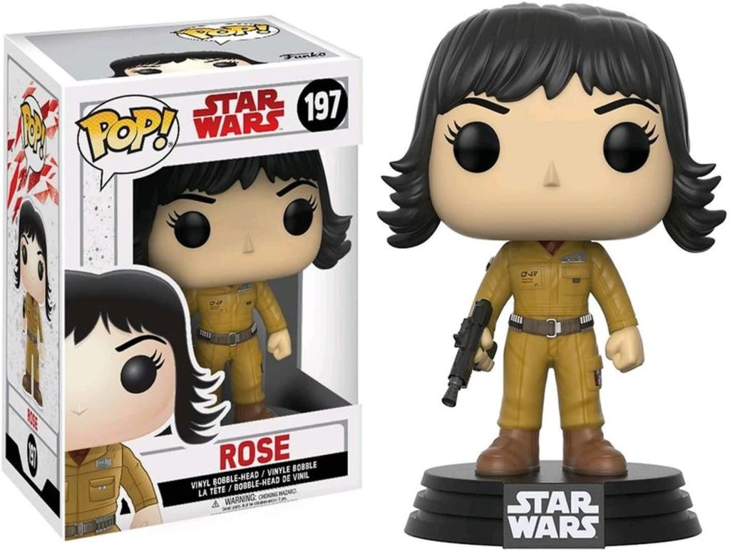 Eine Funko Pop Star Wars Rose Vinylfigur in einer Box, in beigem Jumpsuit und mit einem Blaster.