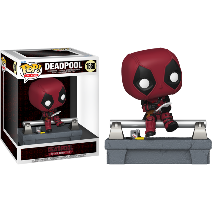 Figura de Deadpool Funko Pop Deluxe sentado en un riel, junto a su caja.