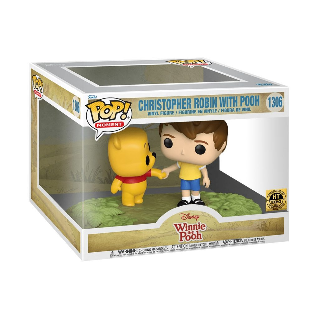 Funko Pop Moment Box mit Winnie Puuh und Christopher Robin, die Händchen halten, auf einer grasbewachsenen Basis.