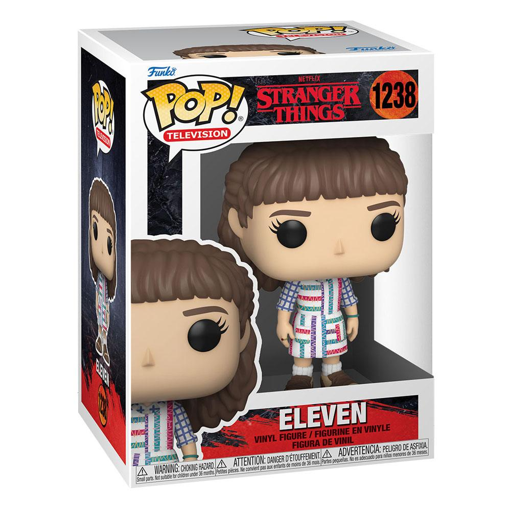 Eine Funko Pop Box mit einer Eleven Vinylfigur aus Stranger Things, mit gemustertem Kleid und kurzen Haaren.