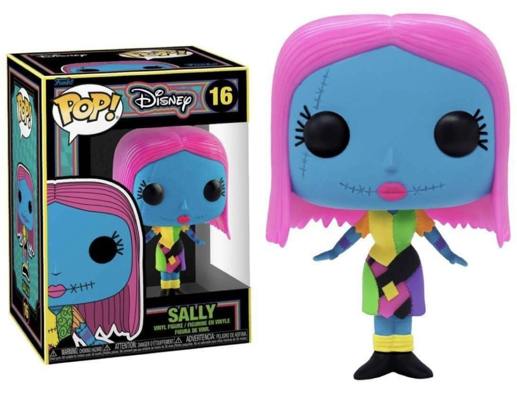 Figure in vinile Sally Funko Pop con capelli rosa e viso cucito accanto alla scatola.
