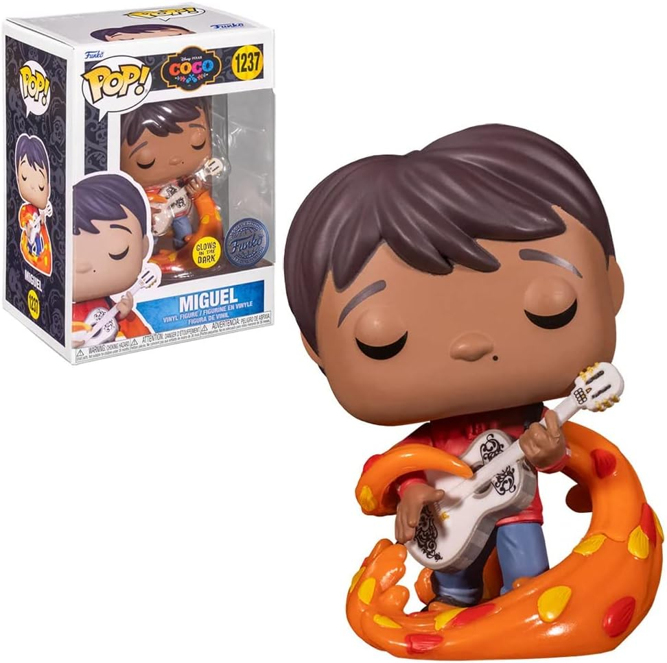 Figura de vinilo Funko Pop de Miguel de Coco, sosteniendo una guitarra blanca, junto a su caja de embalaje.