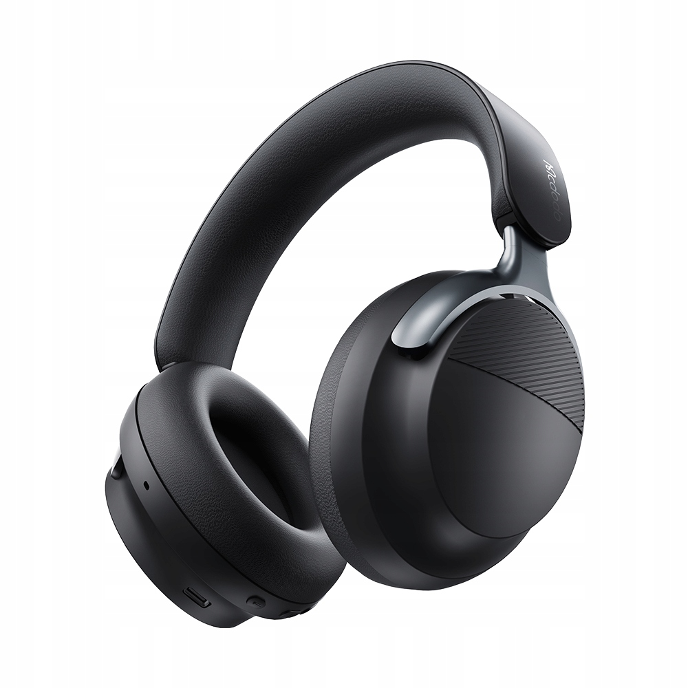 Eleganti cuffie wireless nere over-ear con padiglioni imbottiti e guscio esterno testurizzato su sfondo bianco.