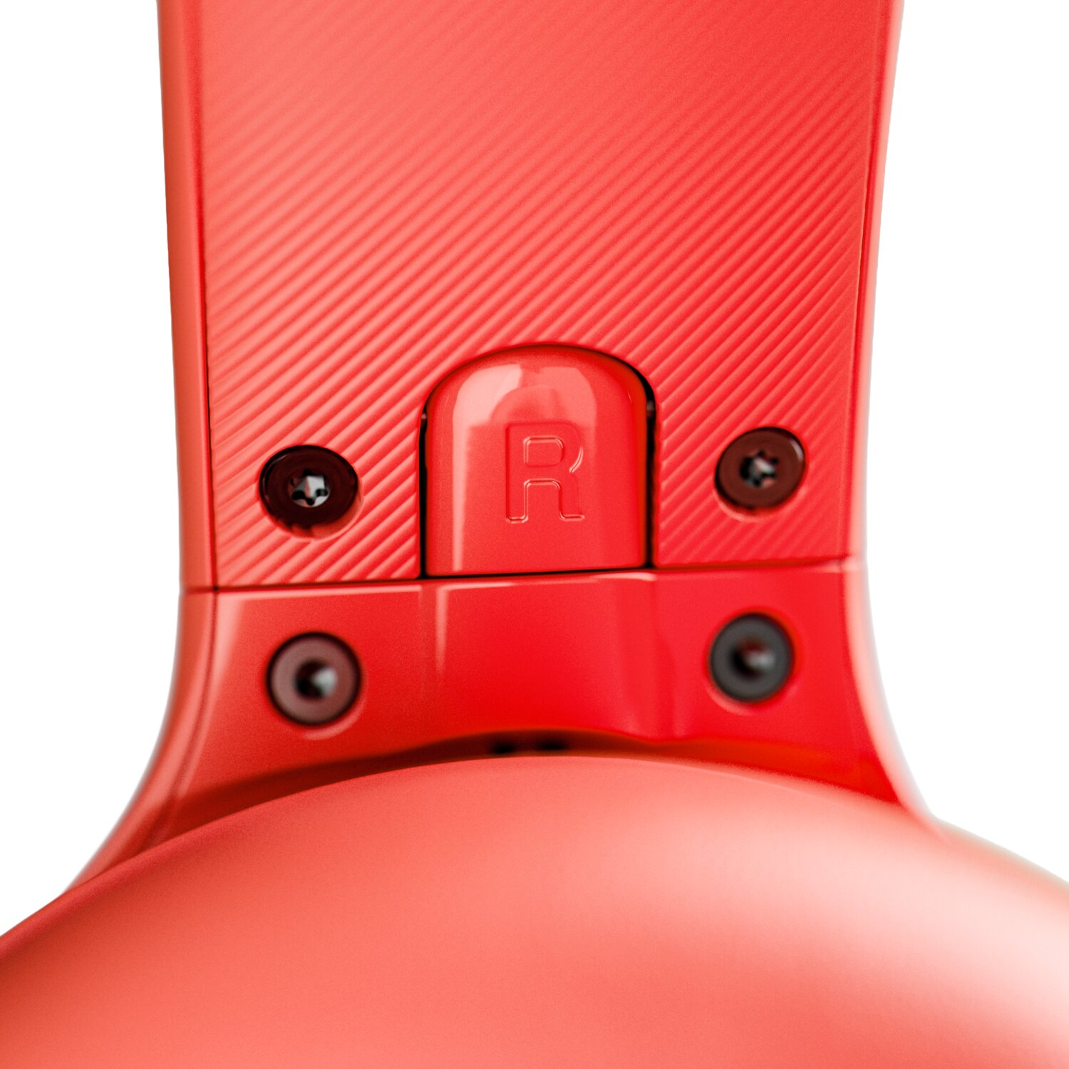 Primer plano de un auricular rojo con una etiqueta R y cuatro tornillos visibles.