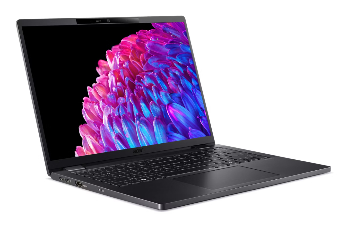 Un elegante laptop nero su sfondo bianco mostra uno sfondo floreale rosa e blu vibrante sullo schermo.