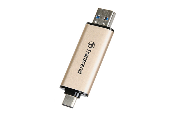 Gold-colored Transcend USB flash drive featuring both USB-A and USB-C connectors.