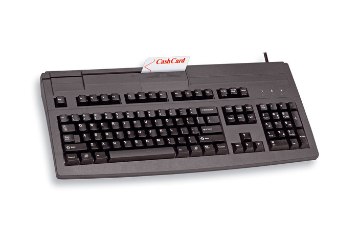 Un teclado de ordenador negro con lector de tarjetas CashCard integrado y una tarjeta blanca insertada.