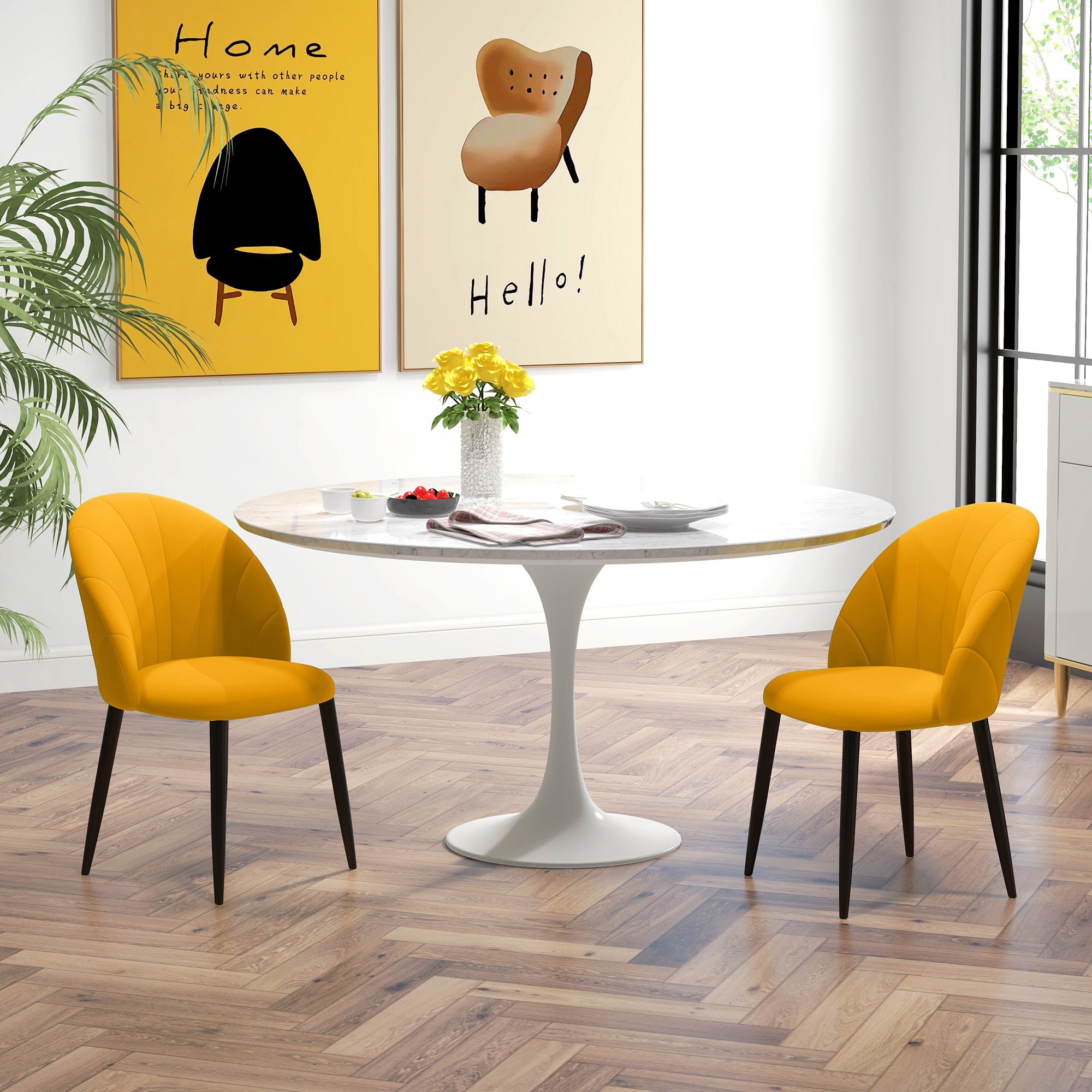 Sala da pranzo con tavolo rotondo bianco, due sedie gialle e fiori gialli sul tavolo davanti a pareti chiare.