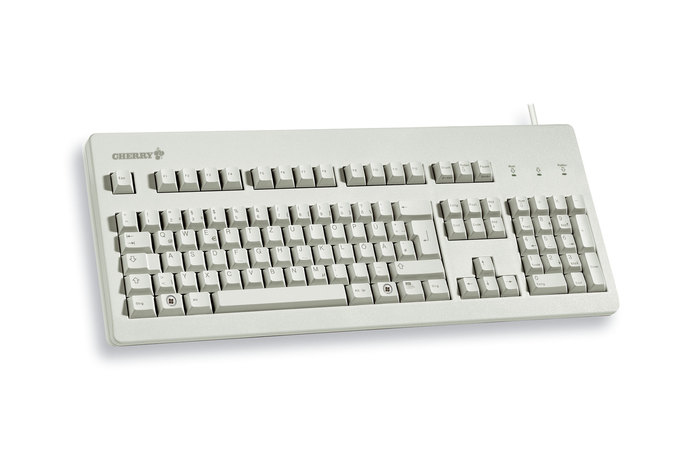 Un teclado de computadora Cherry beige con diseño QWERTZ alemán sobre fondo blanco.