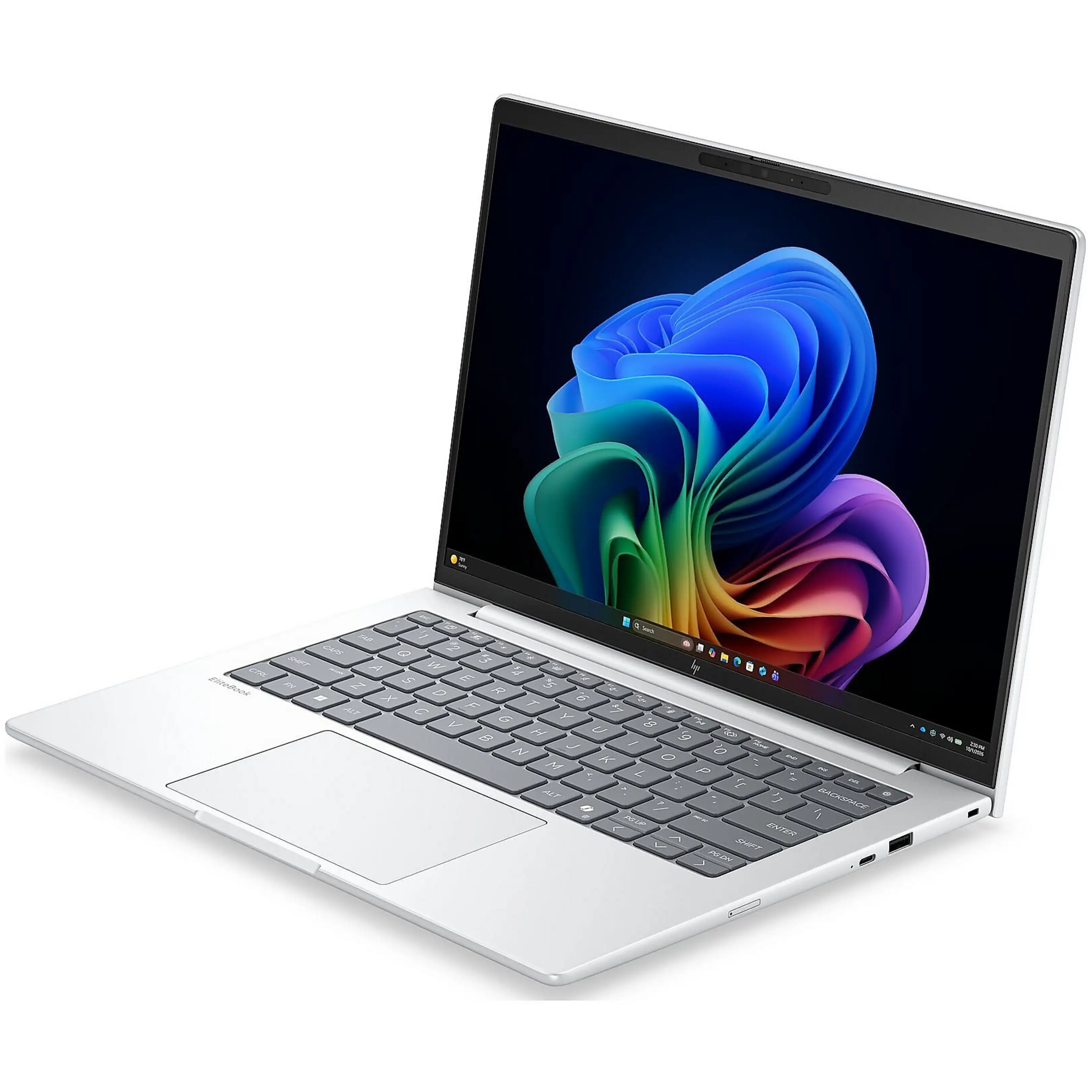 Un laptop argentato con tastiera nera e schermo che mostra un motivo astratto colorato.