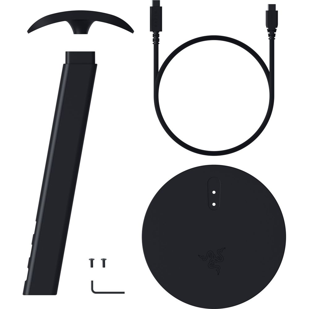 Schwarze Headset-Ständer-Teile, ein USB-Kabel, eine runde Basis, Schrauben und ein Inbusschlüssel auf weißem Grund.